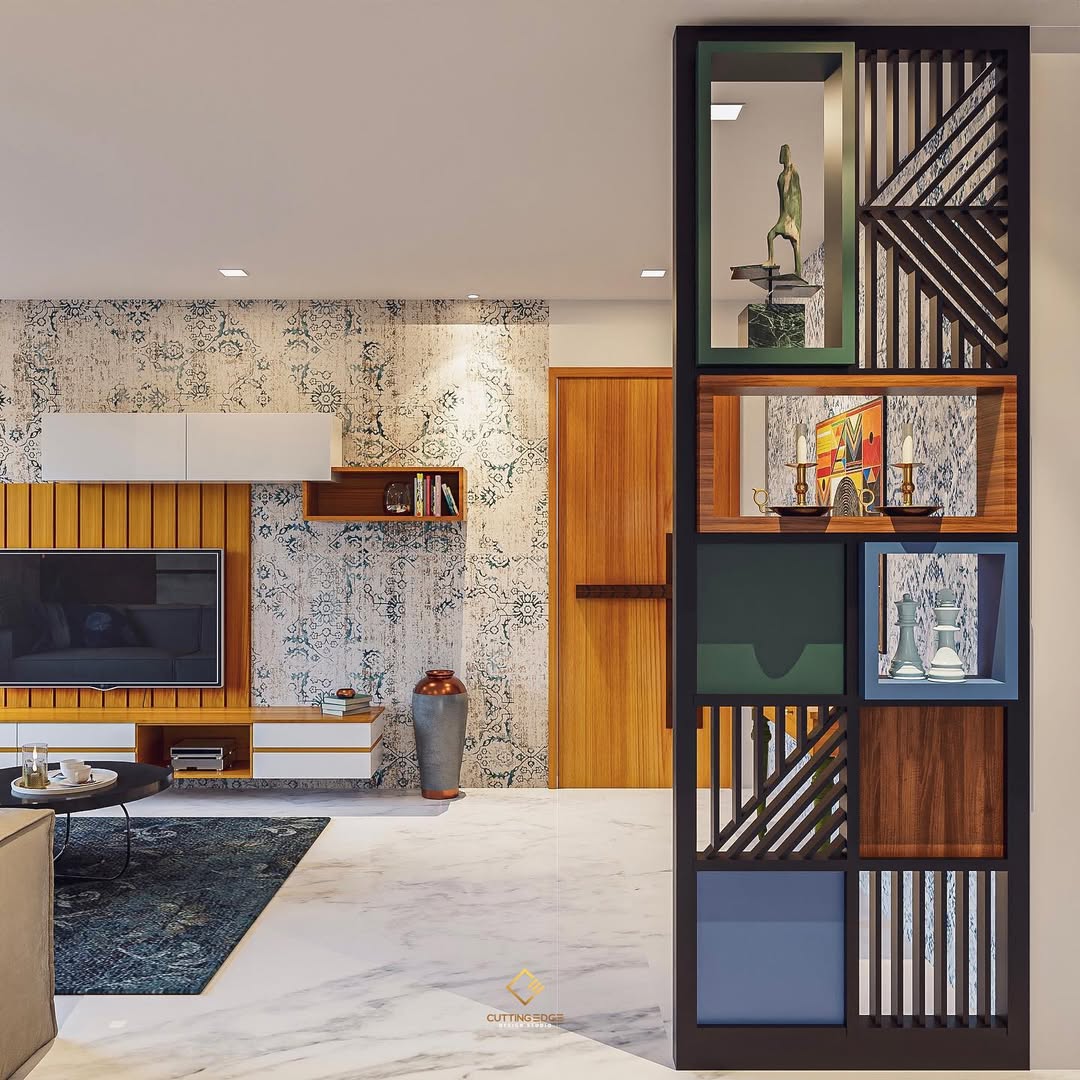 Modern living room with a decorative open shelving unit featuring various geometric patterns—perfect for stylish homeowners seeking instant style and unique divider screen ideas—plus a mounted TV, wood accents, and blue-patterned wallpaper.
