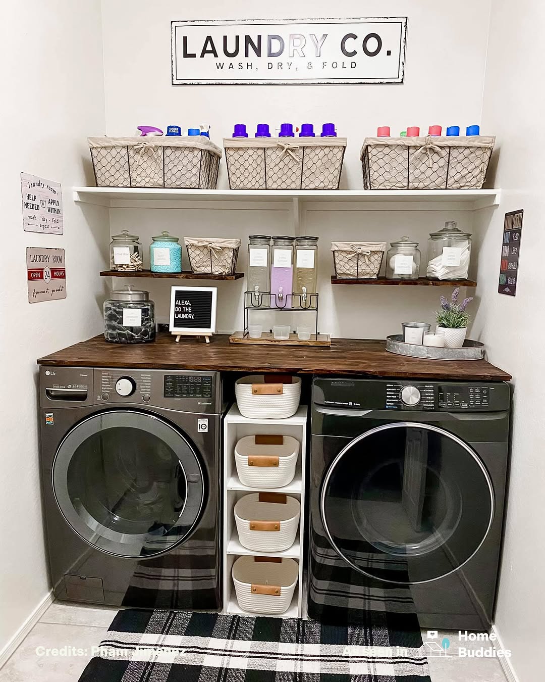 A neatly organized laundry room with a washer and dryer, Laundry Room Shelves holding baskets and jars, and a “Laundry Co.” sign on the wall above them.