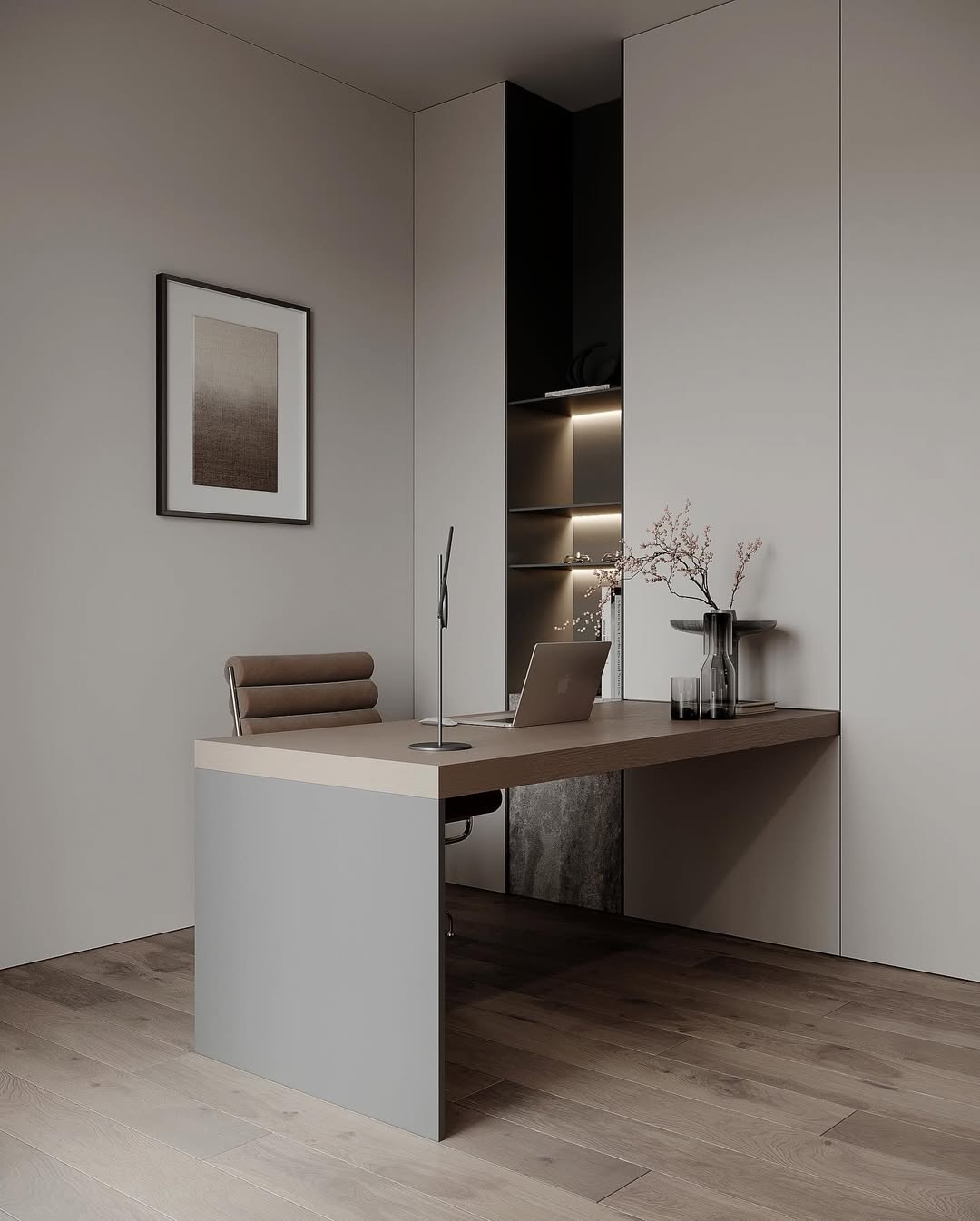Minimalist office design featuring a modern desk, laptop, brown chair, built-in shelves, decorative vases with branches, and framed abstract artwork—a perfect inspiration for those seeking minimalist office ideas.