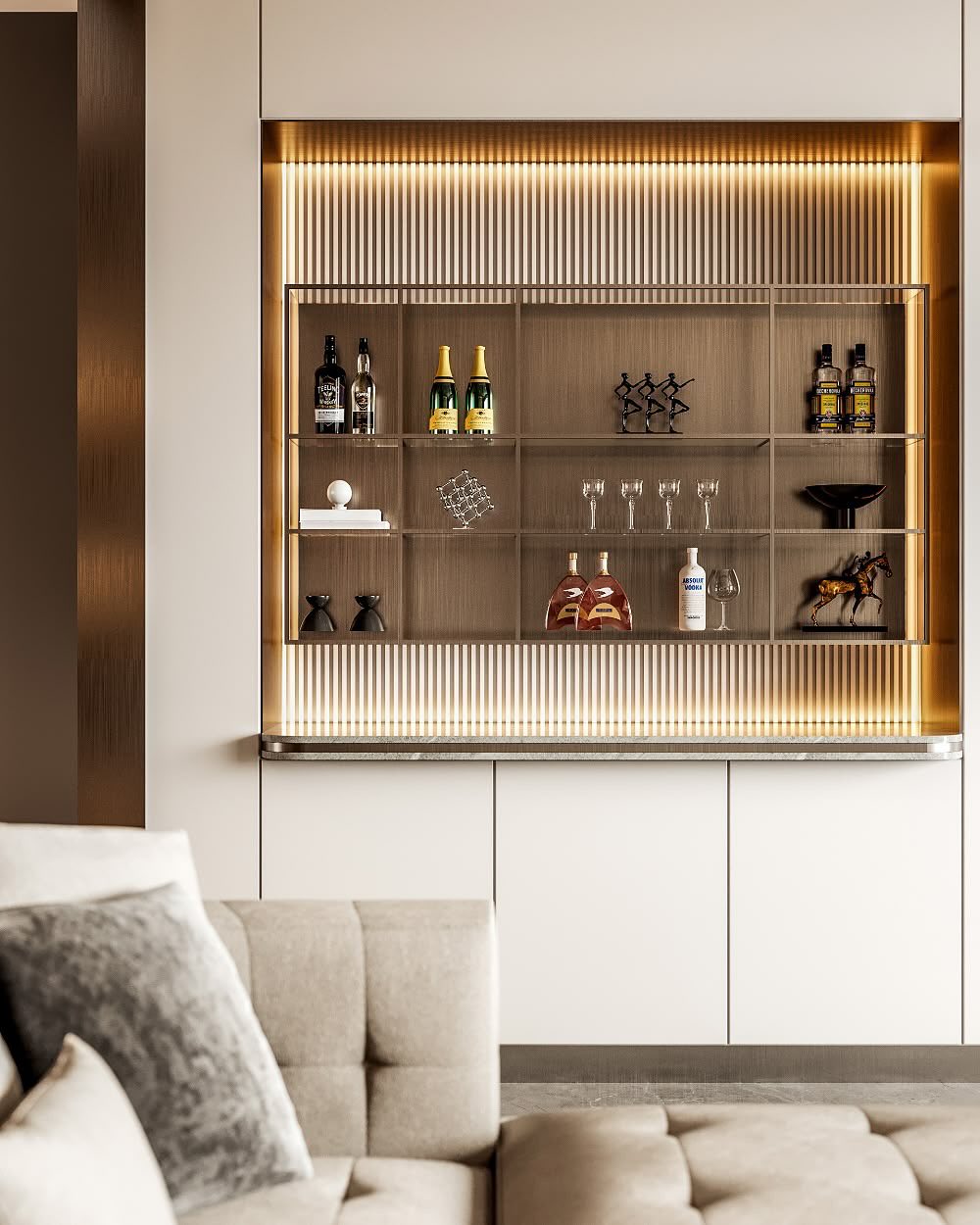 A modern home bar with illuminated shelves displaying bottles, glassware, and decor sits above white cabinets in a minimalist living space—perfect inspiration for gorgeous bar ideas at home.