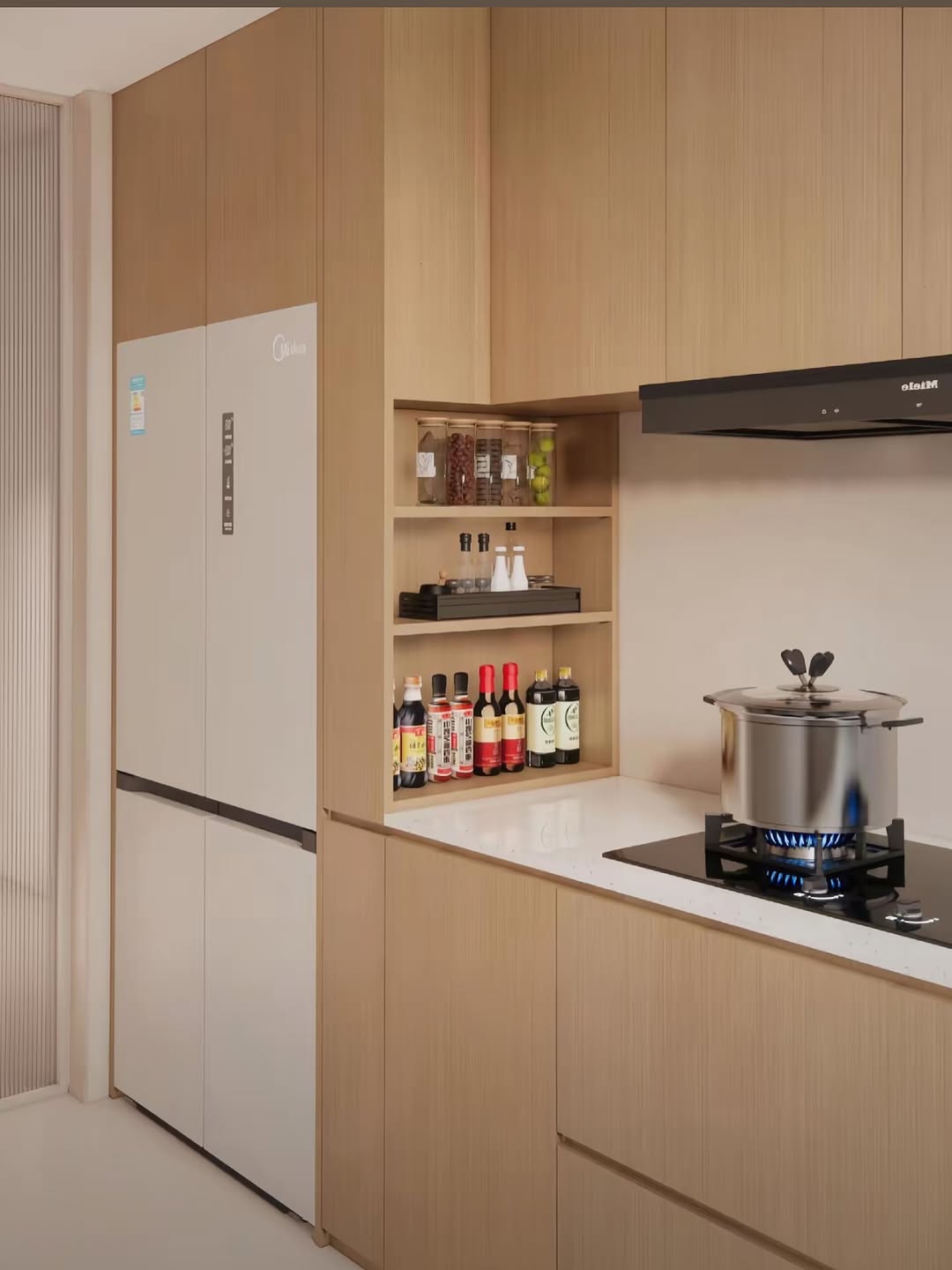 Modern kitchen with light wood cabinets, a refrigerator, open shelves holding condiments, and a pot cooking on a gas stove with a visible blue flame.