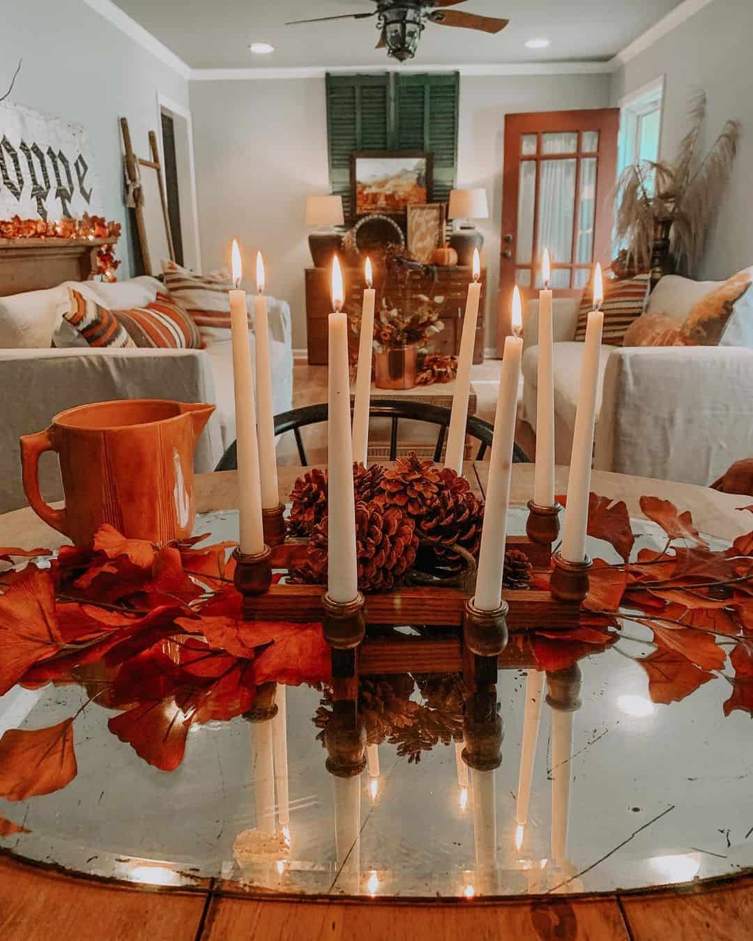 Wooden Candelabra Holds Tall Taper Candles Amidst Fall Leaves