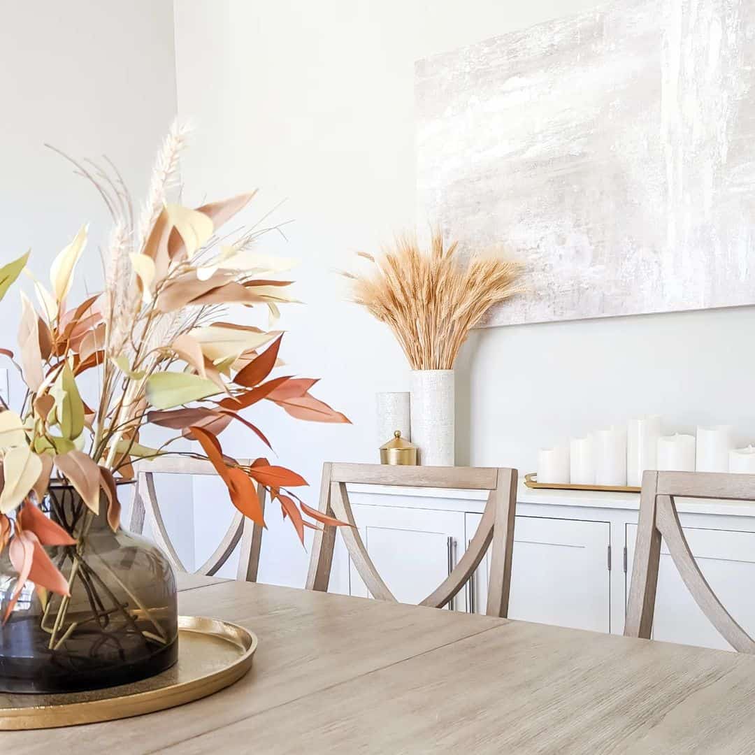 Dried Wheat Stalks in a Tall White Vase Create a Rustic Vignette