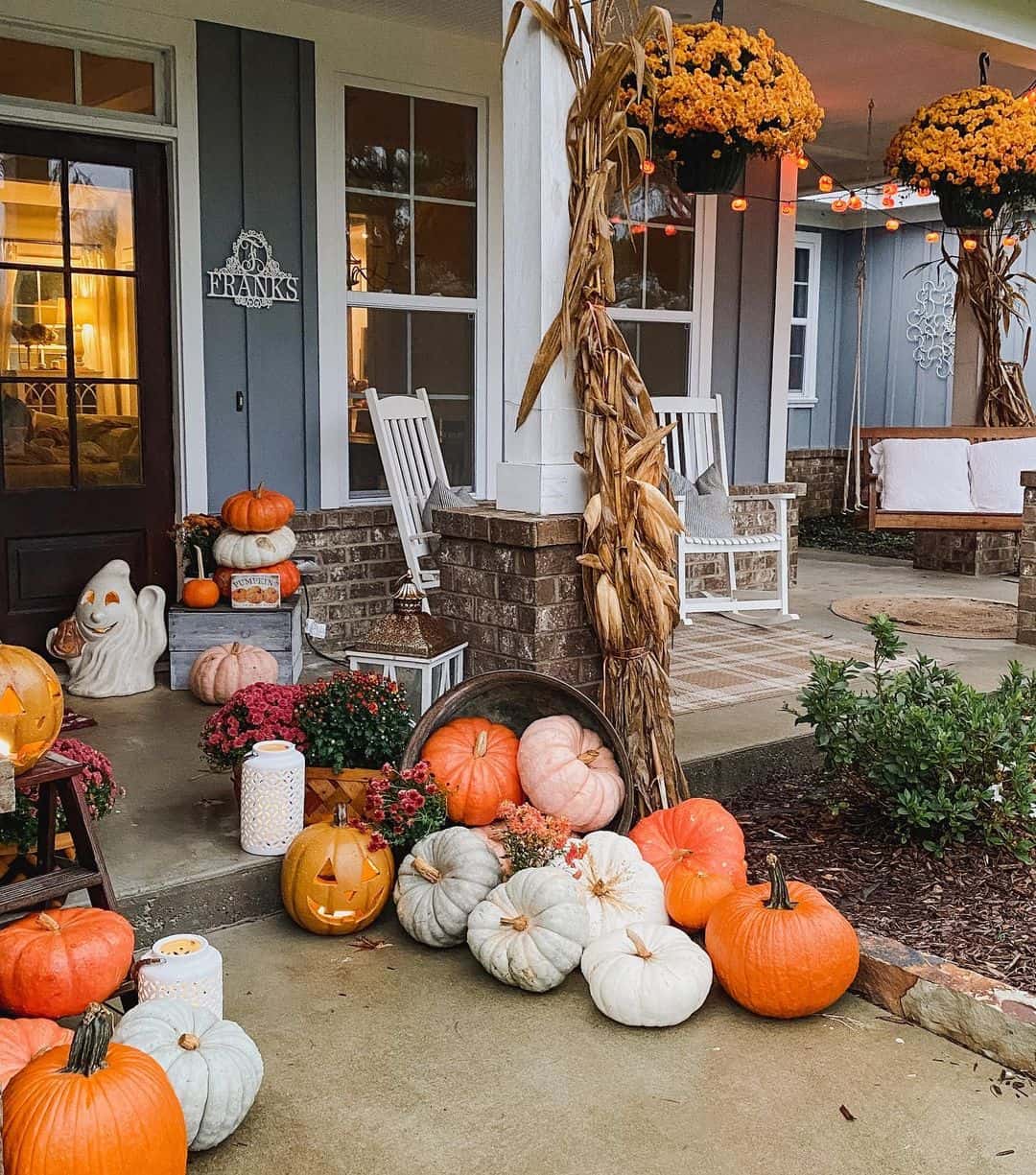Friendly Ghost Lantern and Stacked Pumpkins Welcome Guests