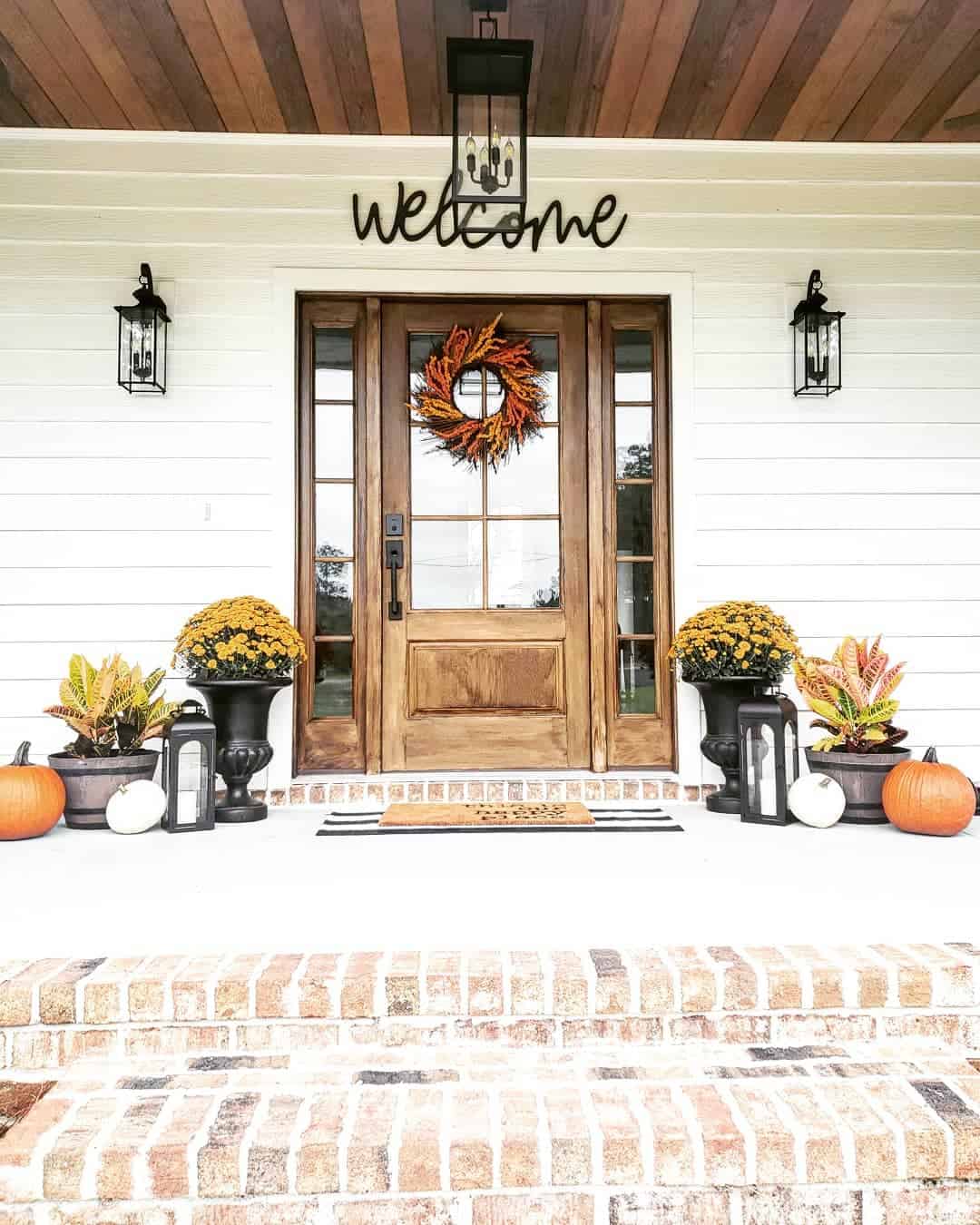 Black Lanterns Frame Mums and Colorful Foliage