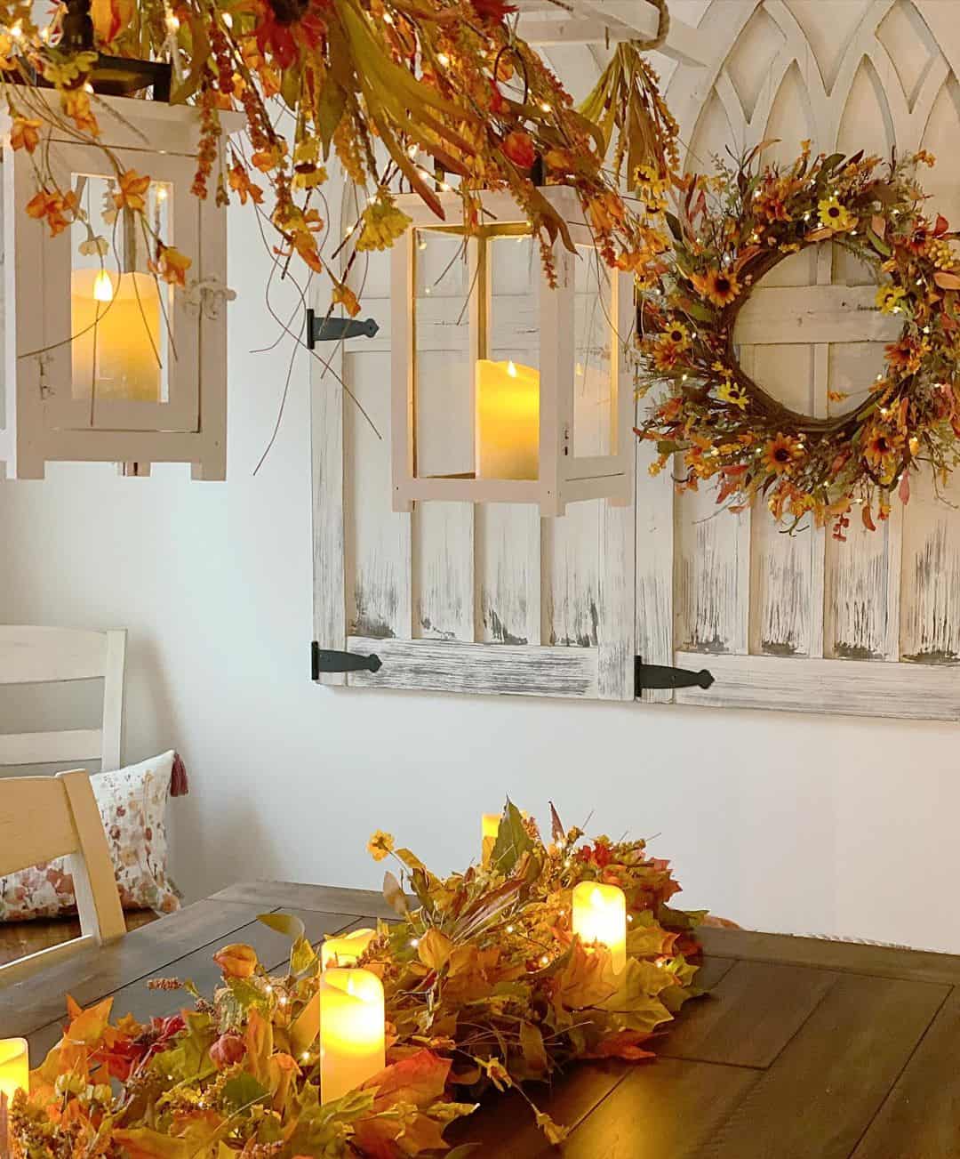 White Lanterns with Aged Metal Accents Add Warmth Above Dining
