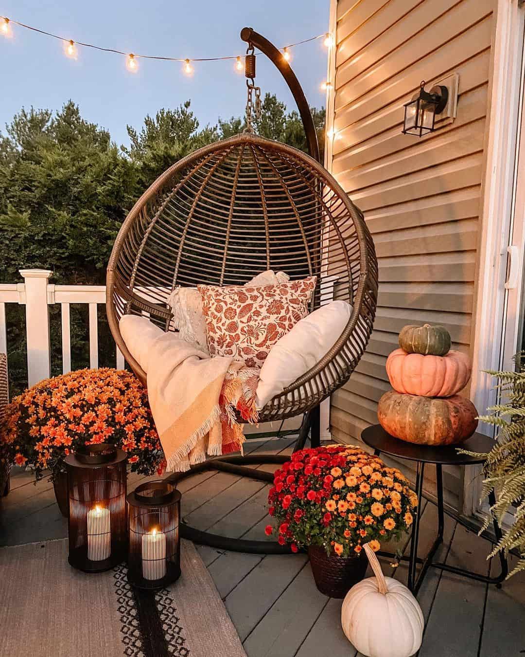 Woven Egg Chair with Fall Pillows and Throws