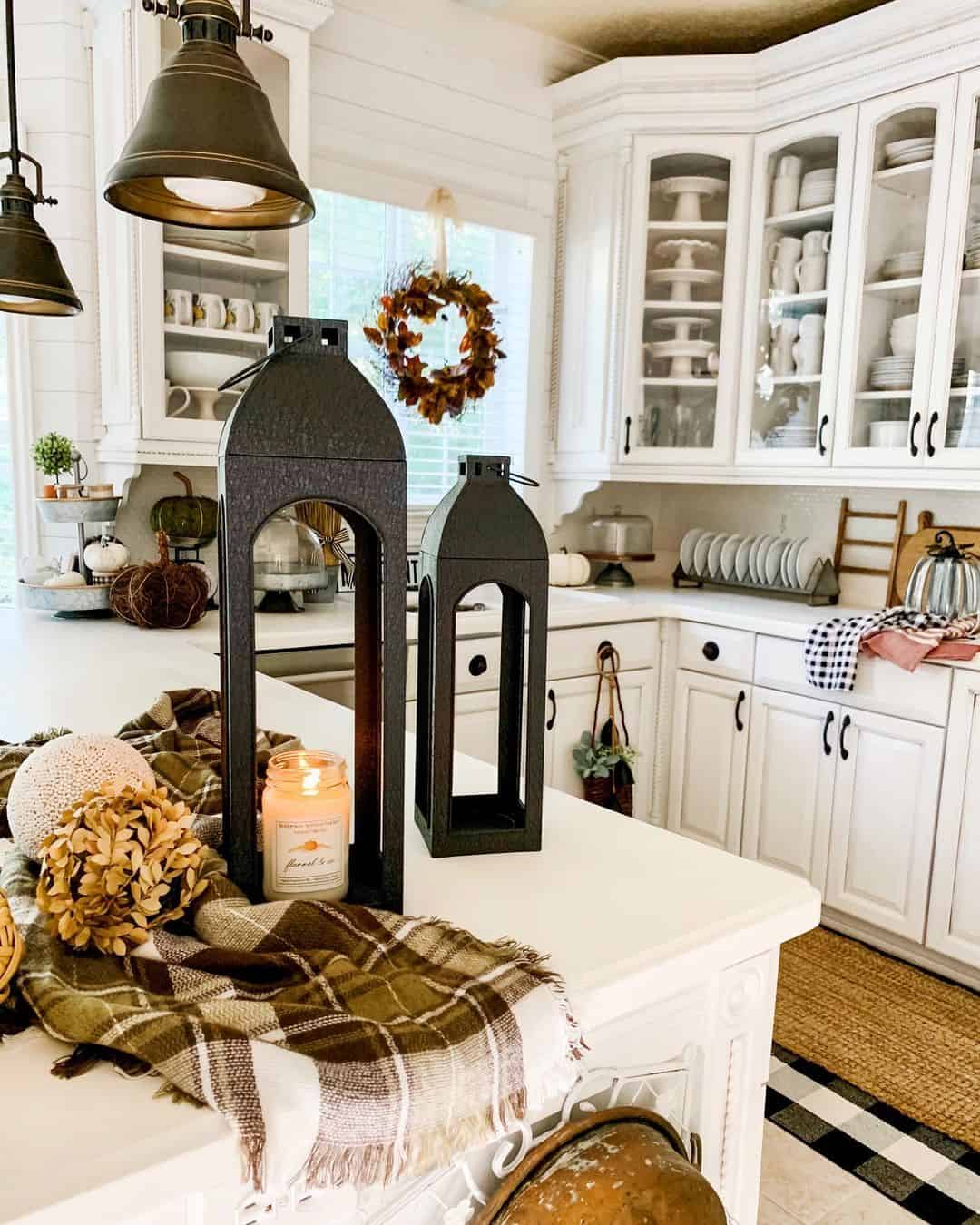 Pair Tall Black Lanterns with Cozy Plaid Throws on Island
