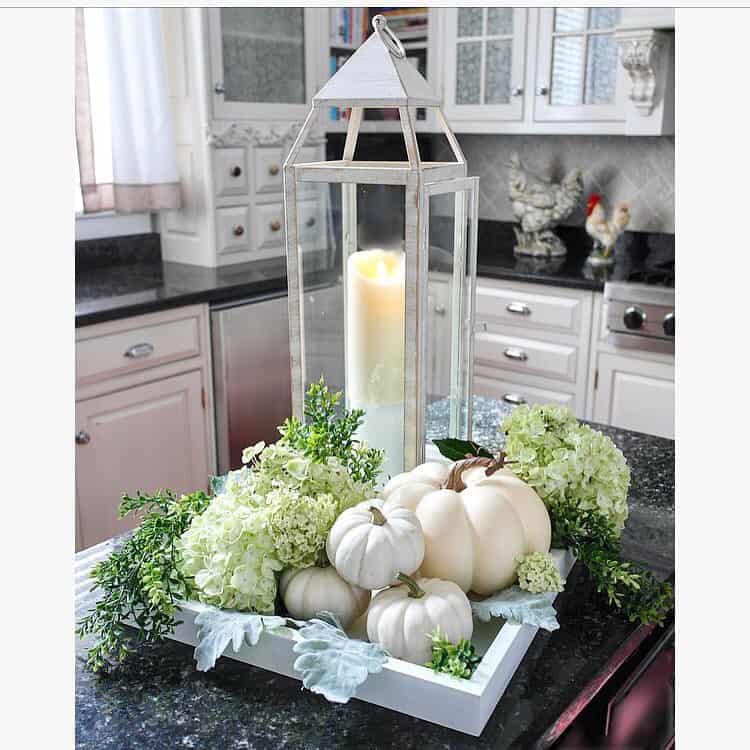 Tall White Lantern Anchors a Tray of Creamy Pumpkins and Greenery