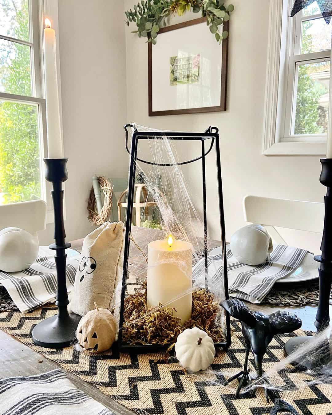 Black Lantern Draped in Cobwebs for a Spooky Centerpiece