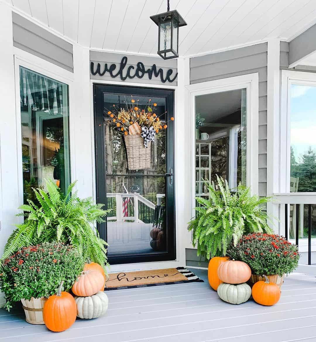 Woven Basket Hung on Screen Door Holds Fall Arrangement