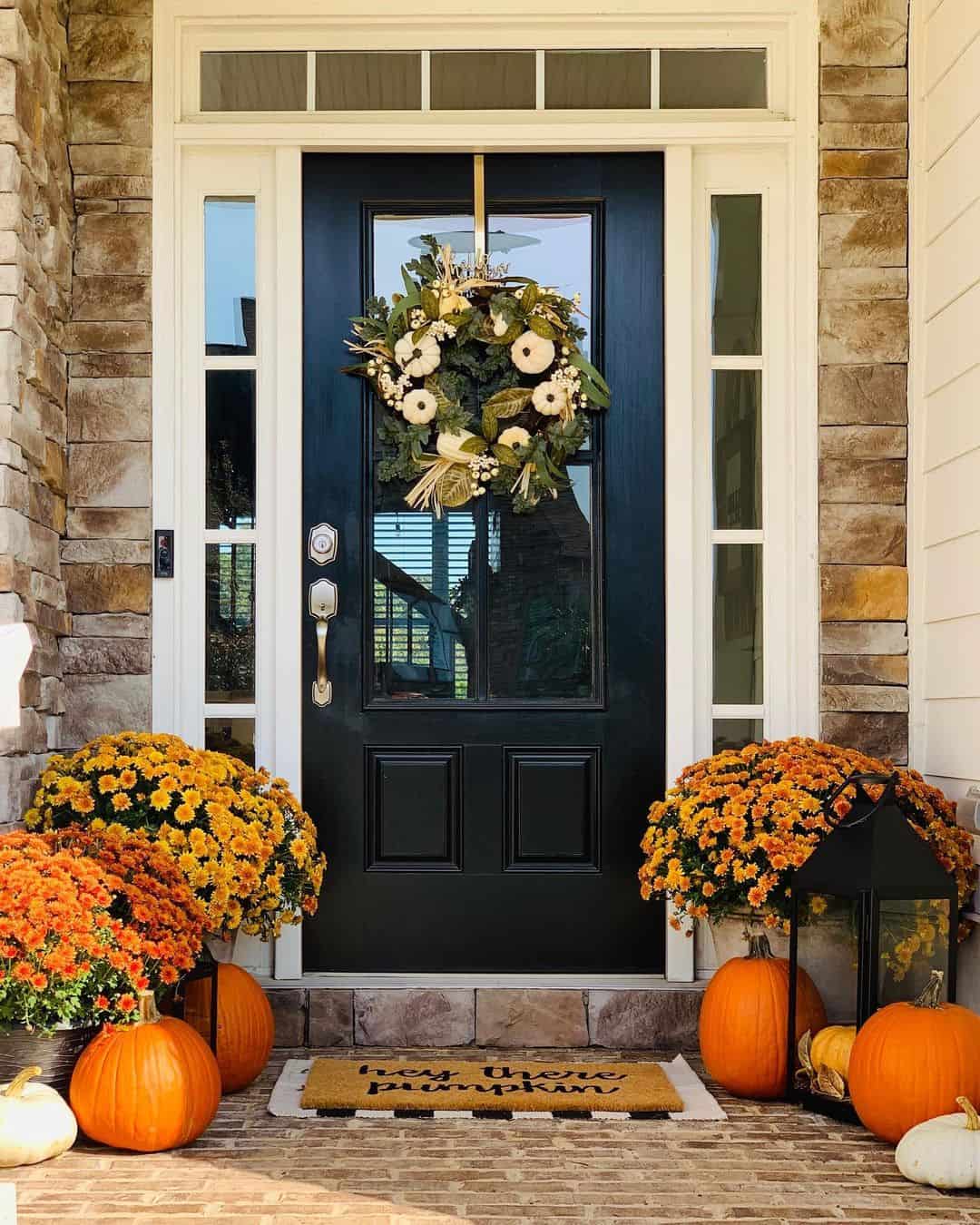 White Pumpkins and Greenery Adorn a Fall Door Wreath