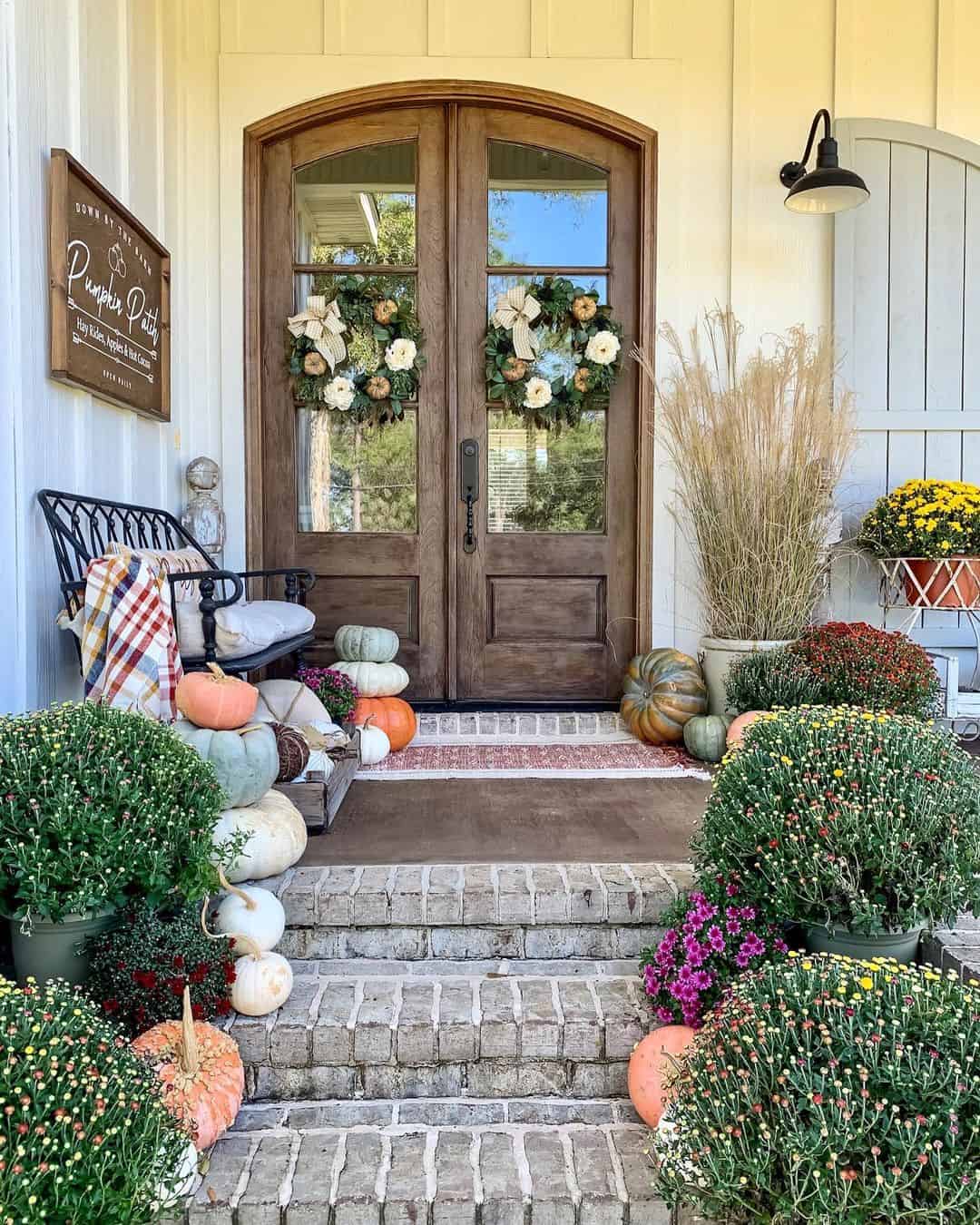 Double Door Wreaths Frame Entryway with Fall Florals