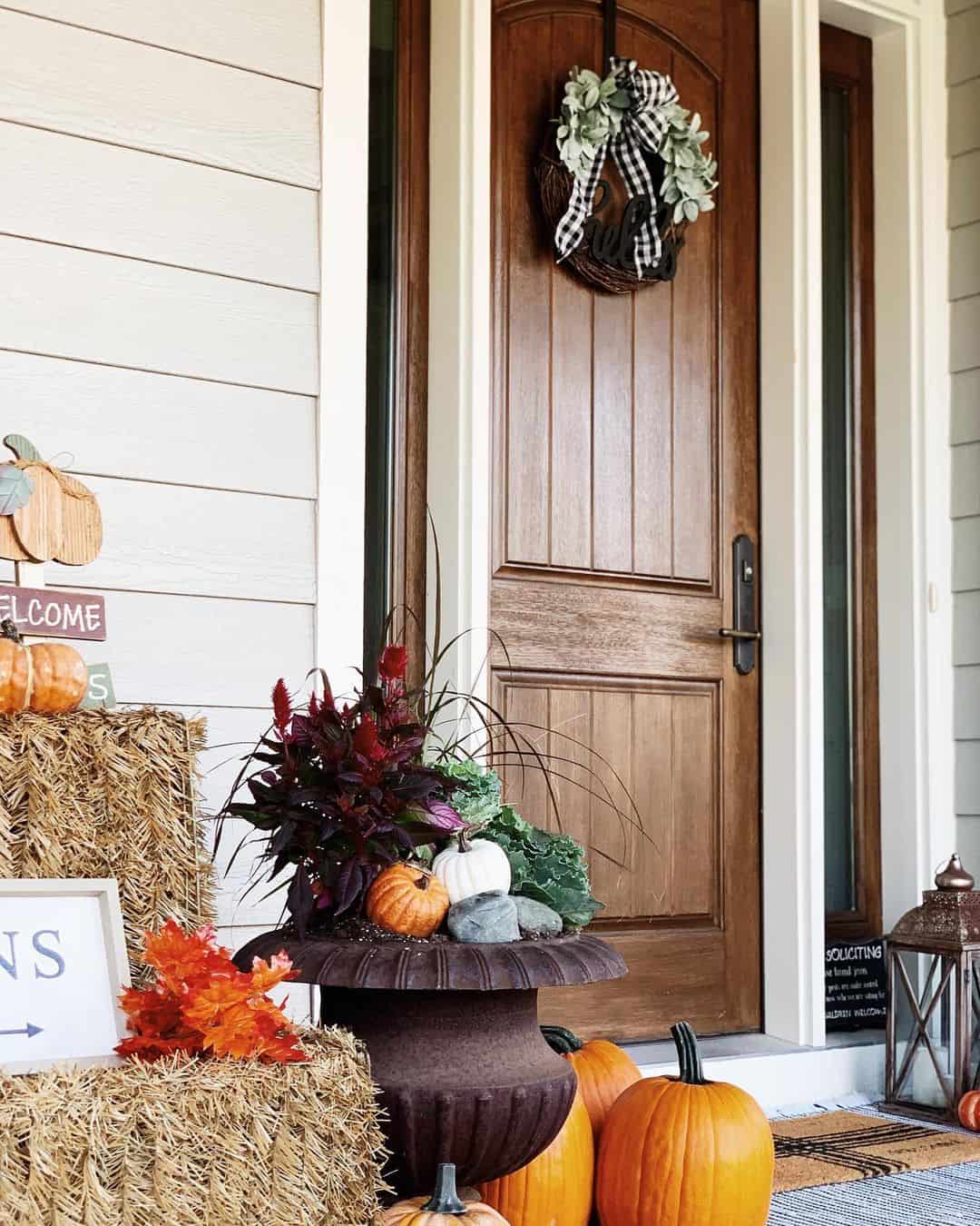 Urn Planter Filled with Autumnal Foliage and Mini Pumpkins