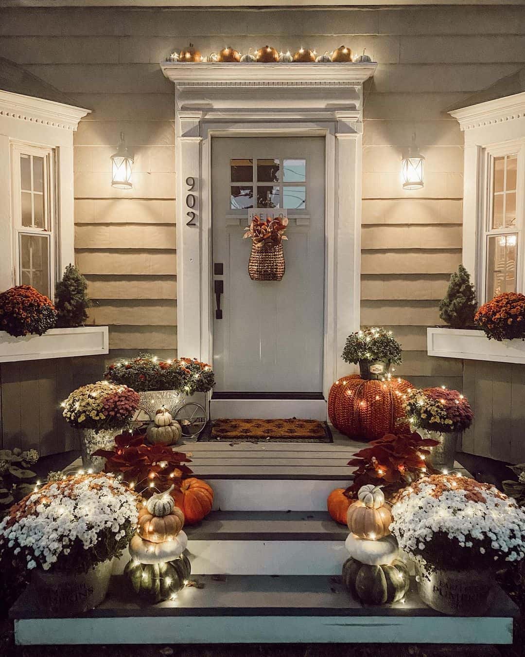 Stack Pumpkins and Lights for a Cozy Staircase Welcome