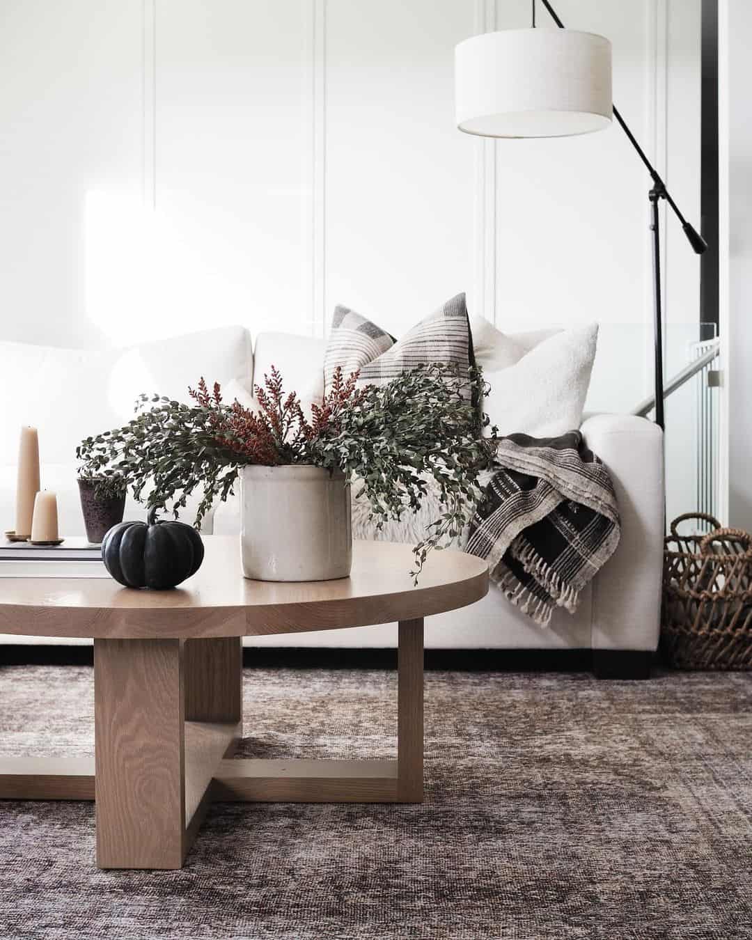Single Black Pumpkin Adds a Subtle Fall Touch to a Coffee Table