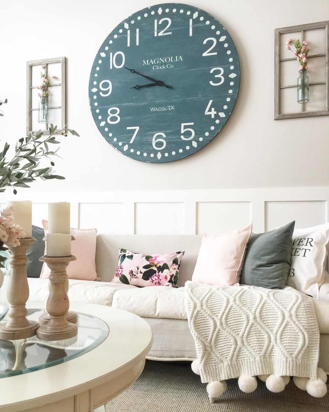 Deep Teal Clock Anchors Living Room With White Wainscoting