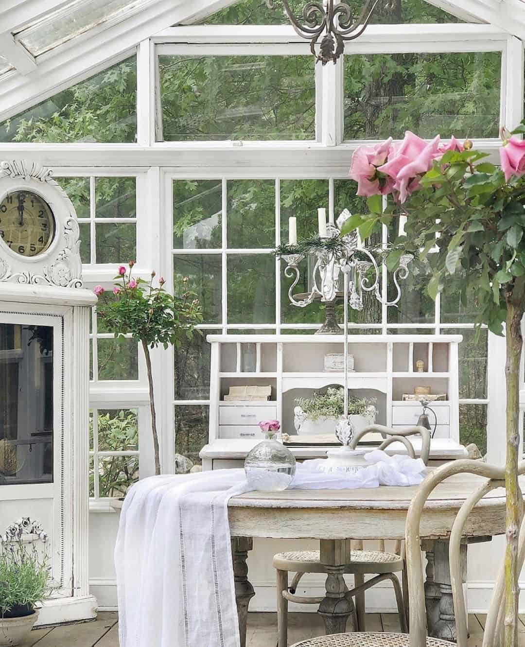 Ornate White Cabinet Holds a Vintage Clock
