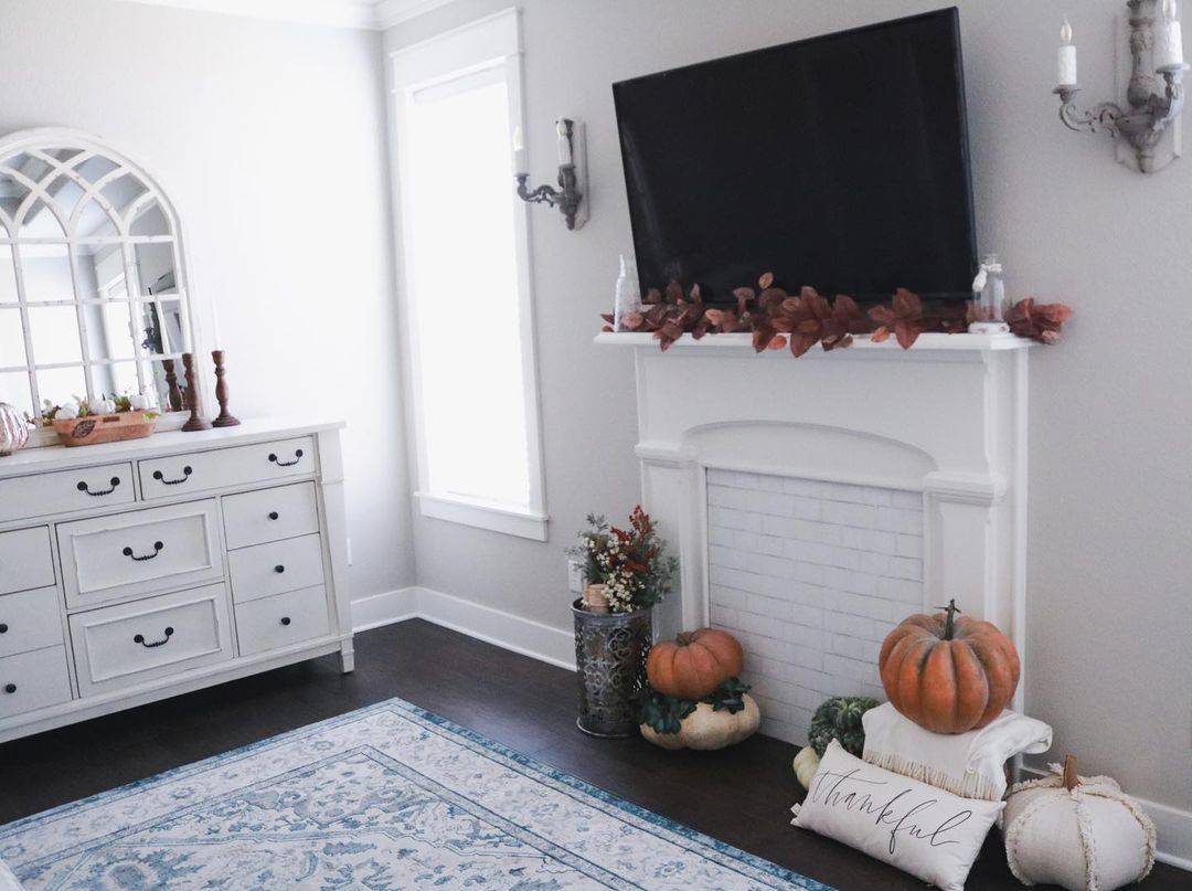 Faux Fall Leaves Frame a Mantel With a TV