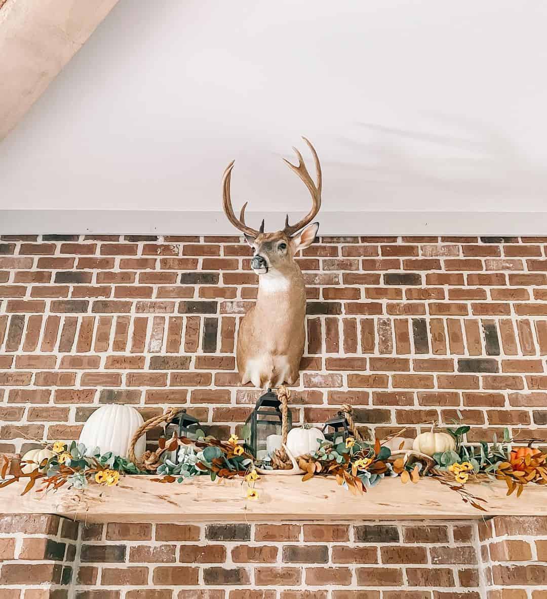 Wood and Rope Garland With White Pumpkins and Lanterns