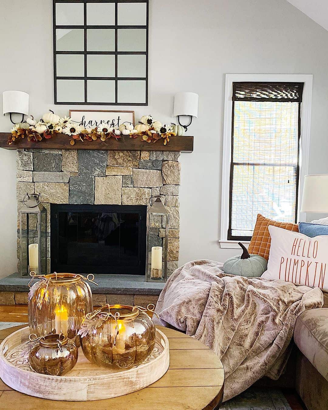 Glass Pumpkin Lanterns Cast a Warm Glow on a Coffee Table