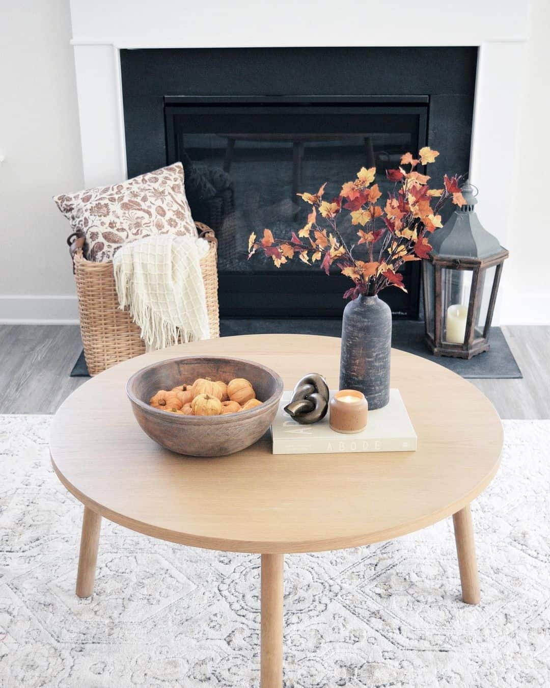 Wooden Bowl of Mini Pumpkins Anchors Coffee Table