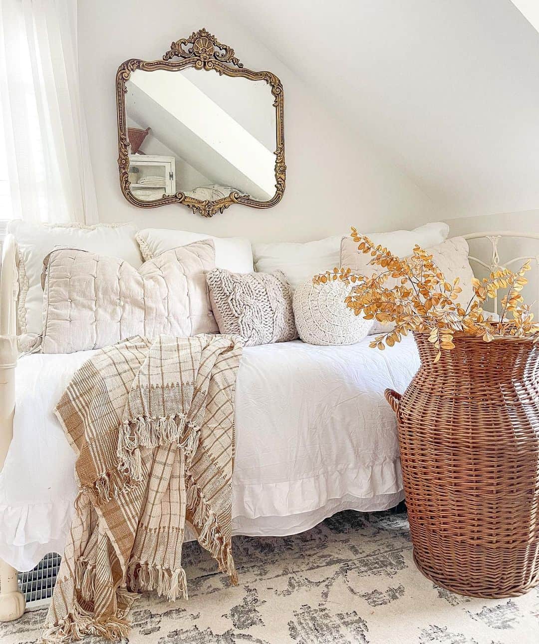 Ornate Gold Mirror Adds Vintage Charm Above Daybed