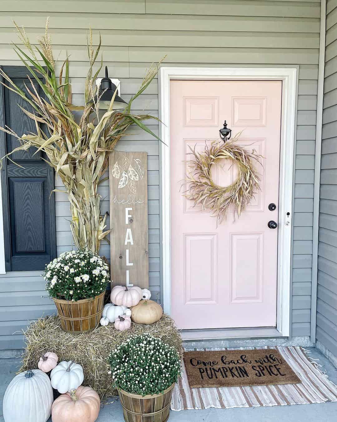 Corn Stalks Add Height to Mums and Pumpkin Display