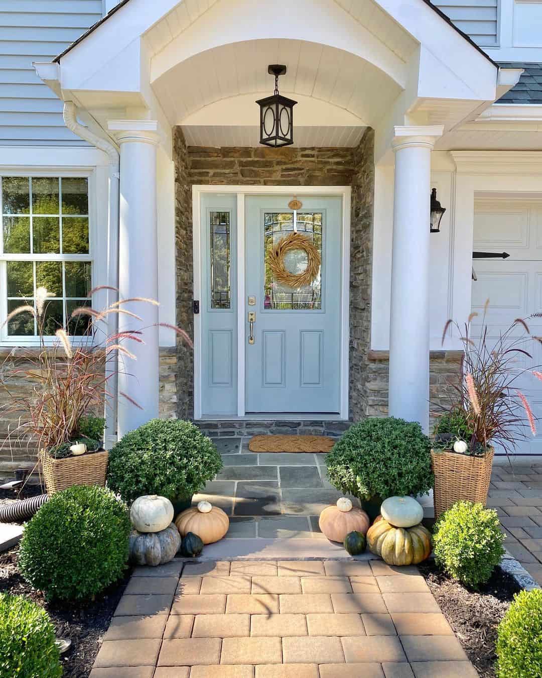 Woven Baskets Hold Ornamental Grasses and Pumpkins