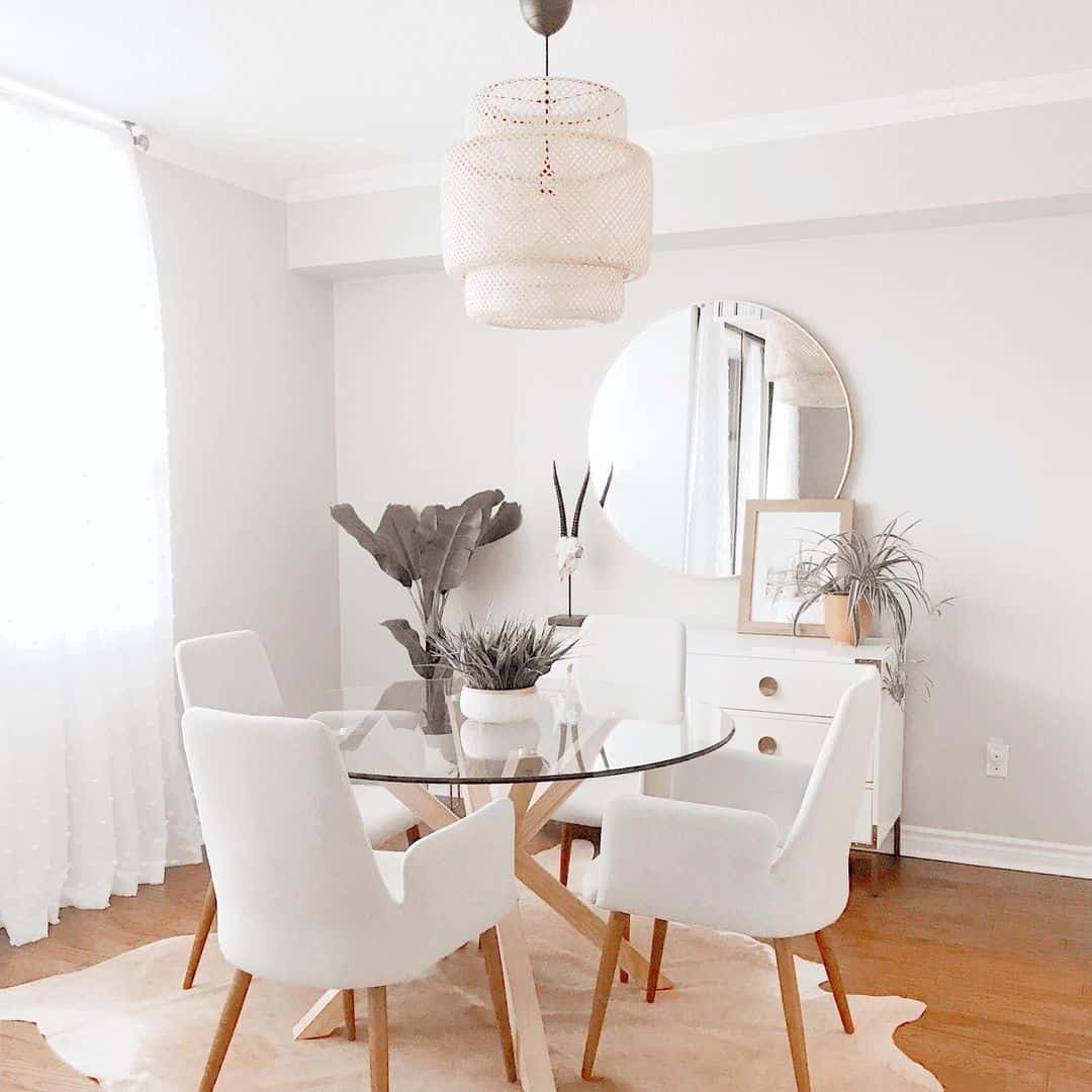 White Farmhouse Dining Room With Glass Table