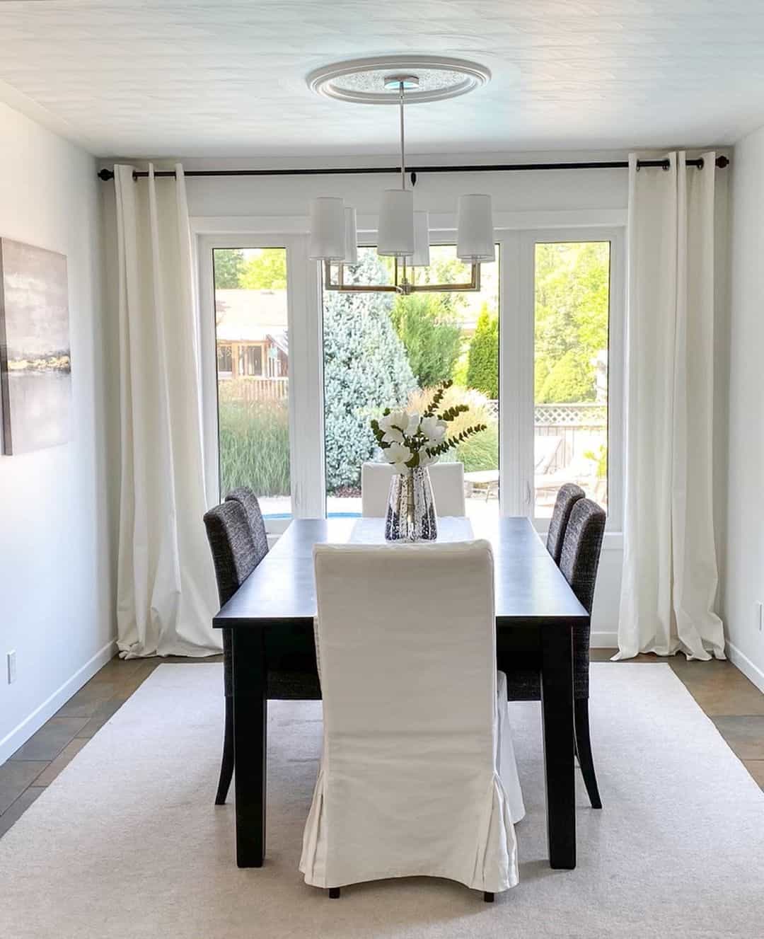 White Dining Room With Black Table