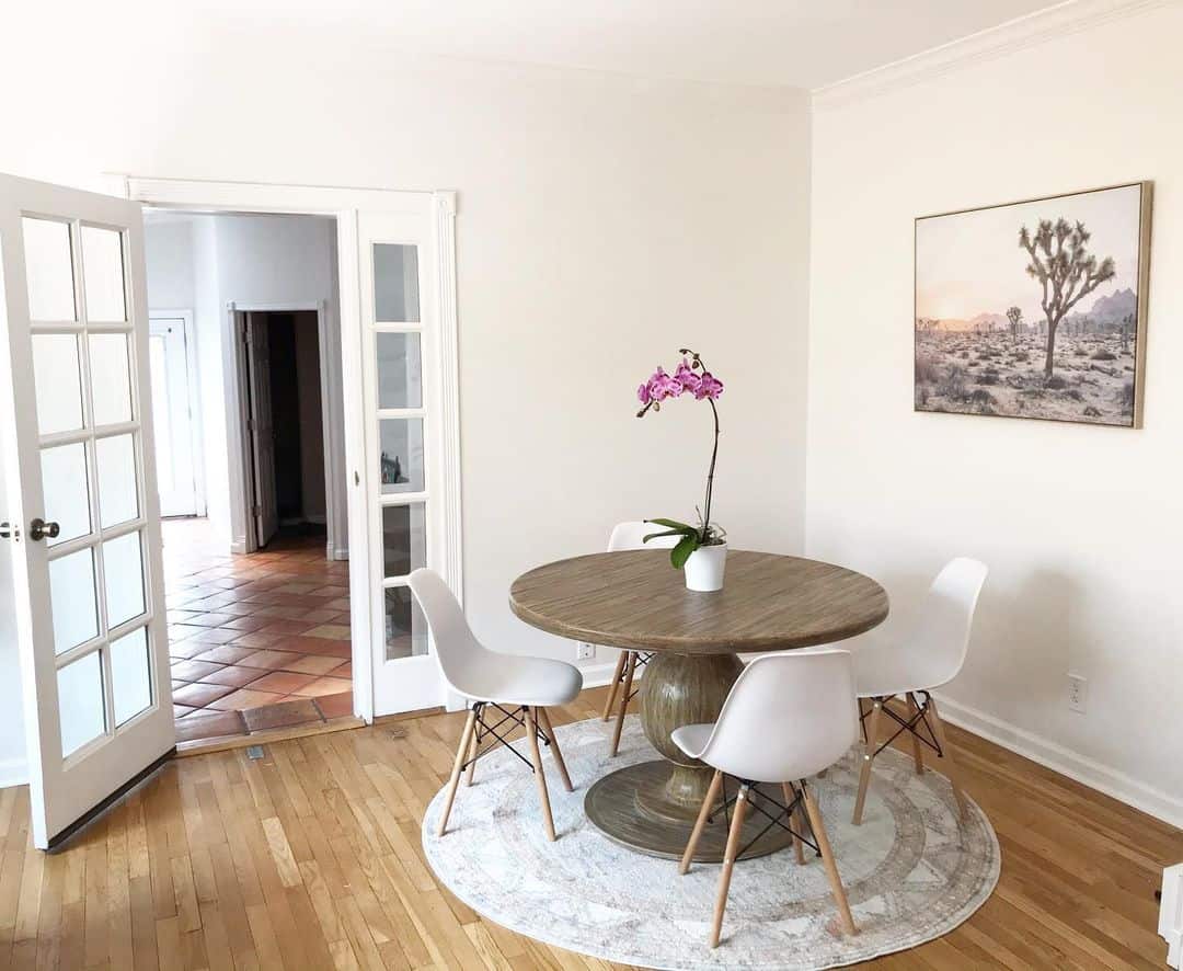 White Minimalist Dining Room With Framed Painting