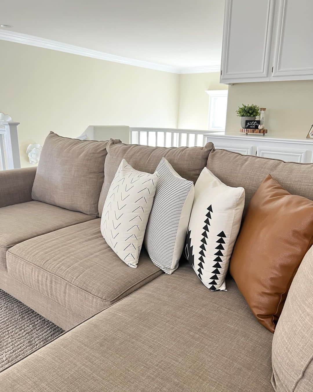 Layered Pillows on Heathered Couch