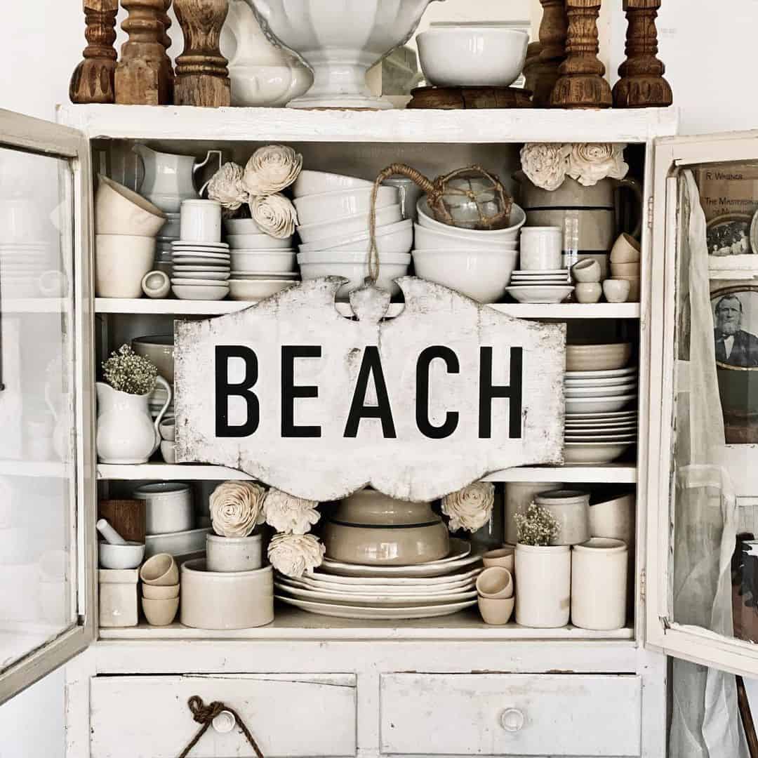 Antique White Hutch With White Beach Sign