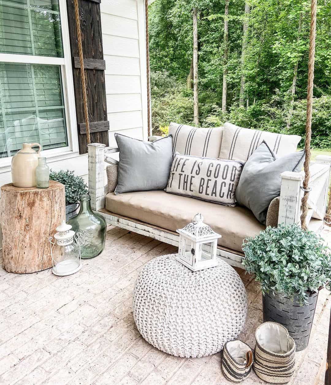 Beachy Patio With White Porch Swing