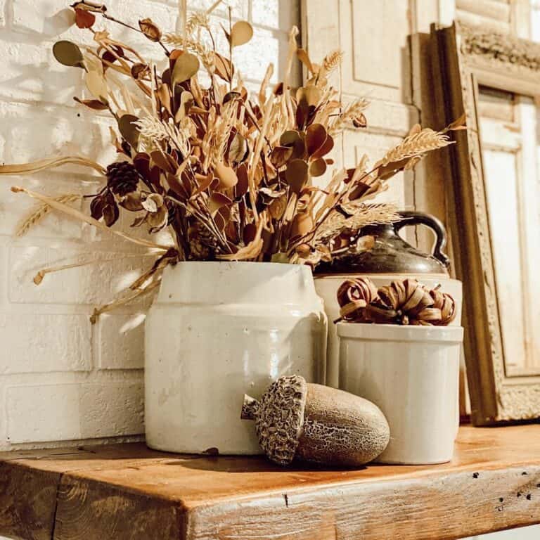 Fall Décor Gathered on a Mantel Corner