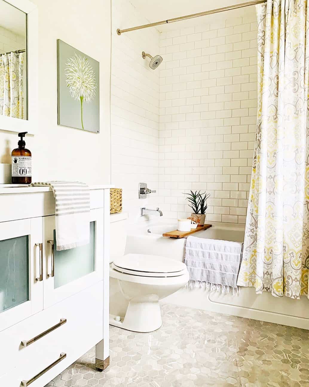 Brass Rain Shower Head and Terracotta Floor Tiles