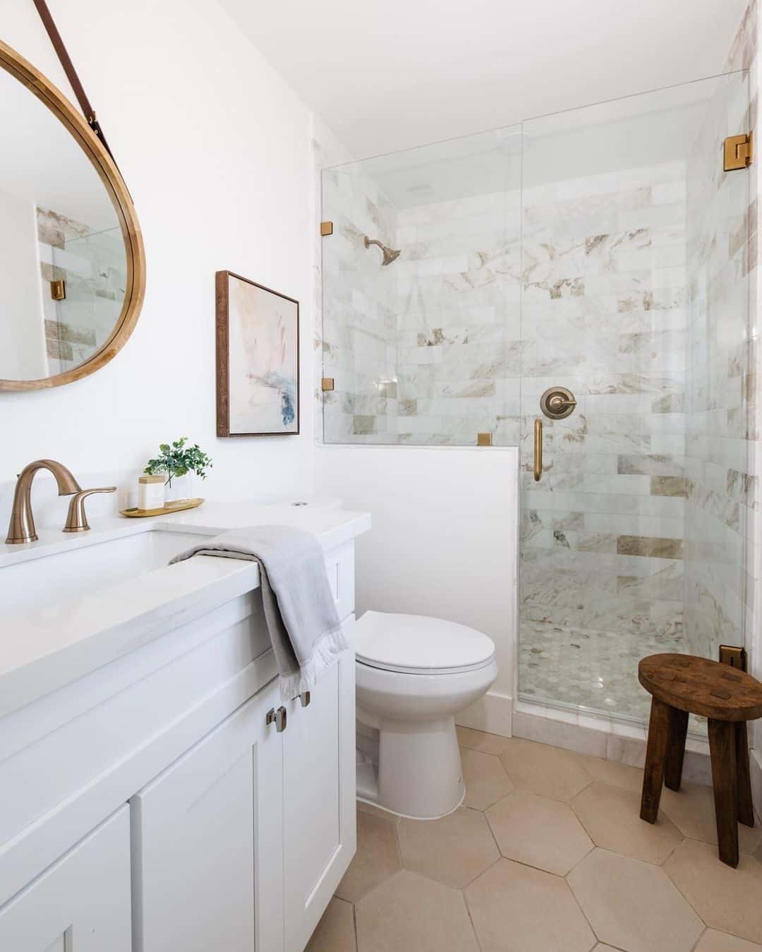 Antique Brass Shower Head on White and Brown Tiled Wall