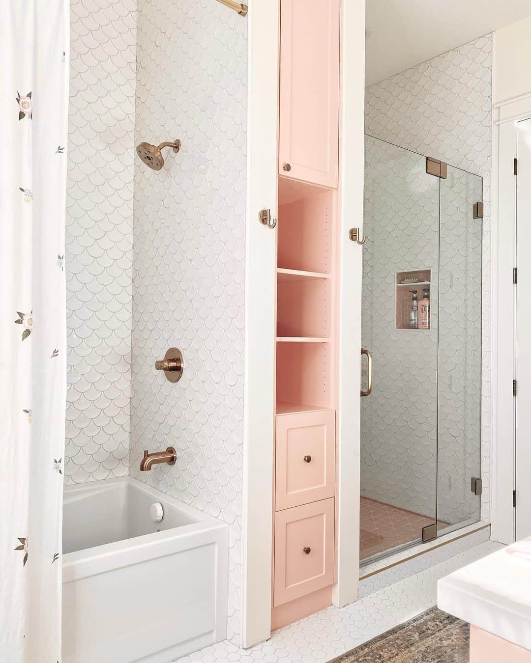 Brass Shower Head on a White Fish Scale Tile Wall