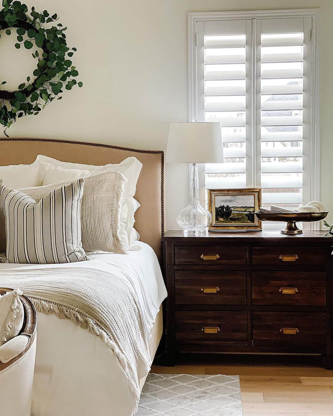 Glass Lamp on a Dark Wood Nightstand with Gold Handles