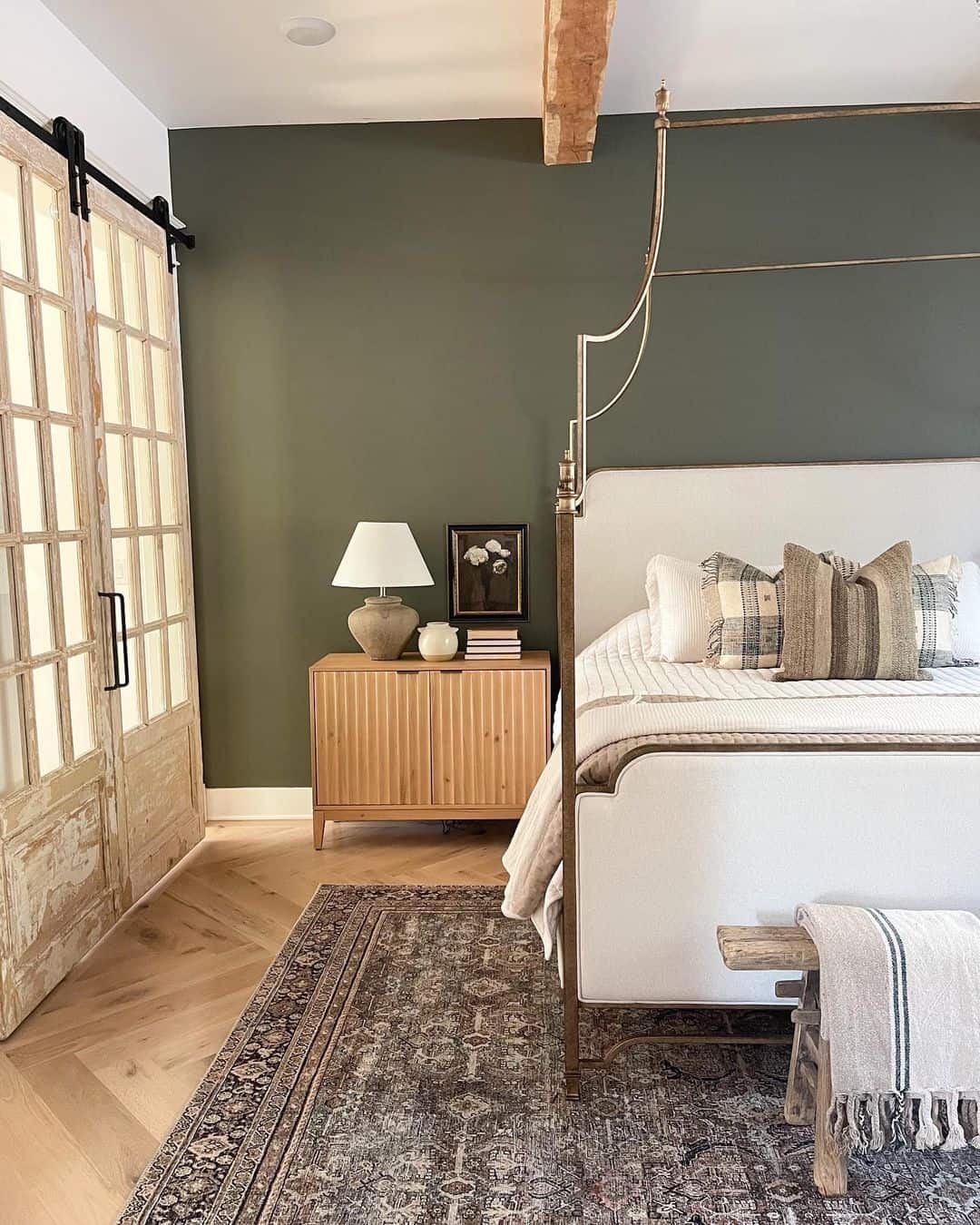 A Wooden Nightstand on a Herringbone Wood Floor