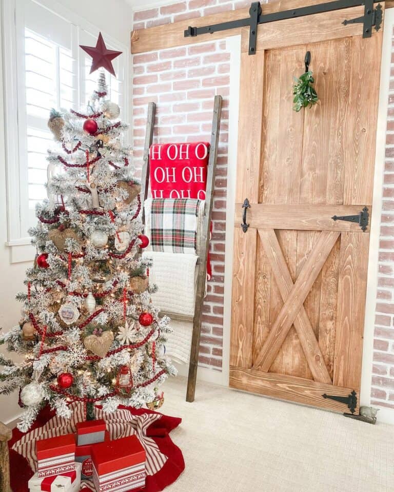 Primary Bedroom with Small Flocked Tree Decorated in Red and White