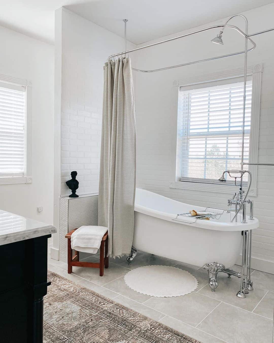 Chrome Clawfoot Bathtub Beneath Shower Window