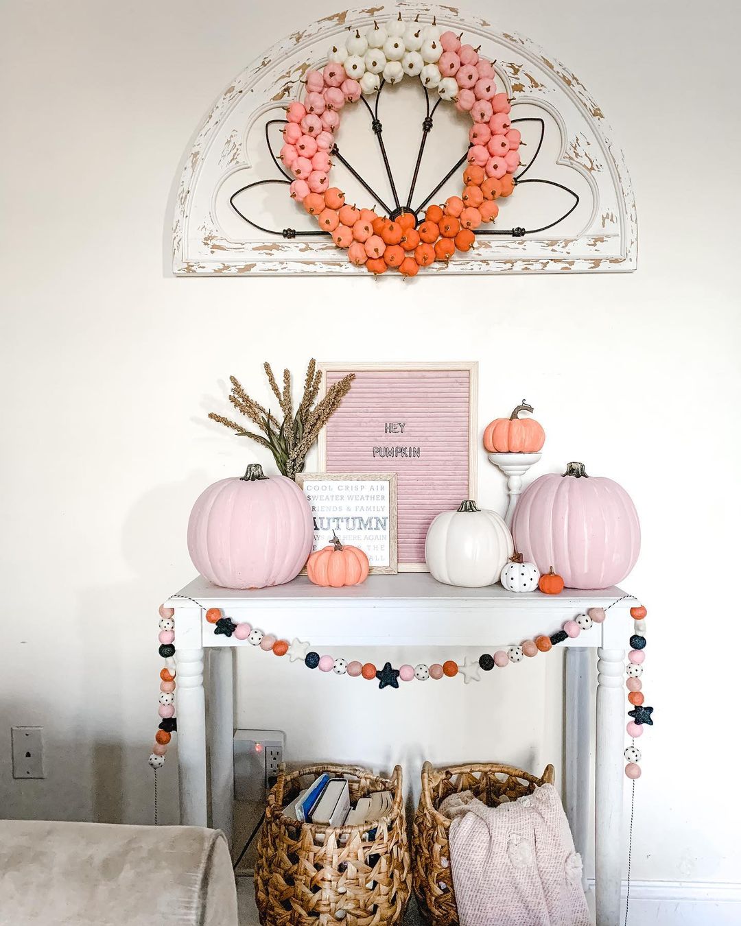 Pink Pumpkins and Garland on a Console Table
