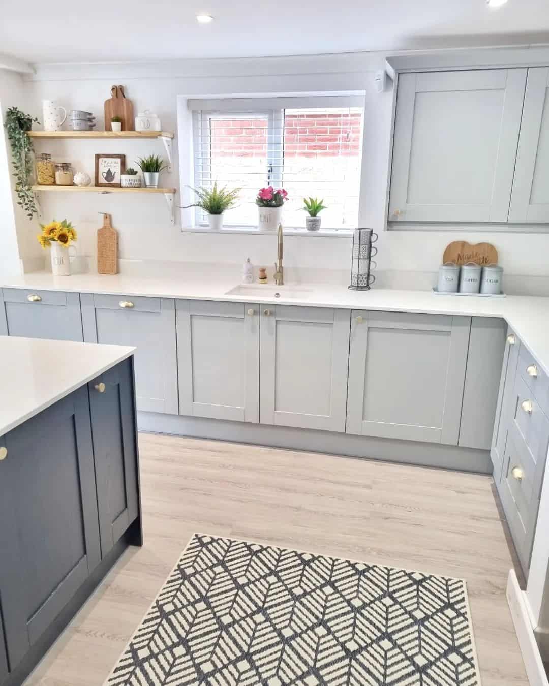 Airy Kitchen With Multi-toned Gray Cabinets