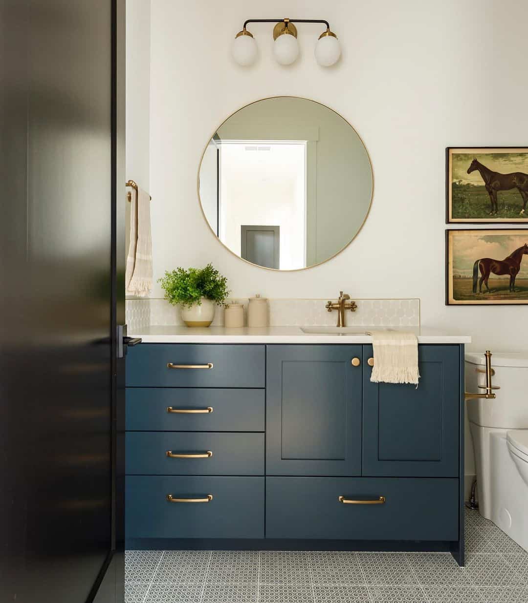 Dark Blue Vanity on Gray Tile Flooring