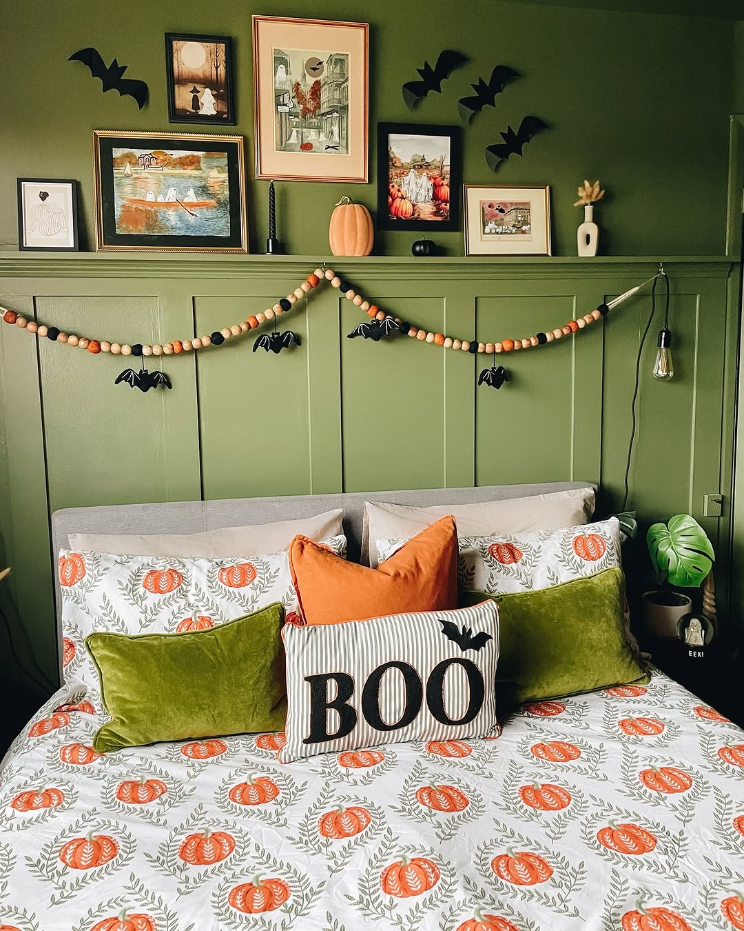 Playful Pumpkin Accents in a Moody Green Bedroom