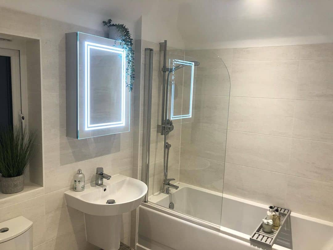 Soaking Tub Shower Combo Beside Pedestal Sink