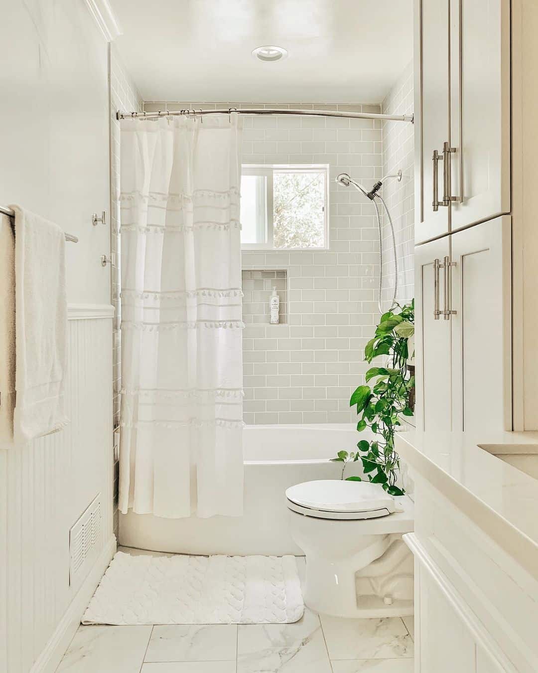 Splash of Greenery in Neutral Bathroom