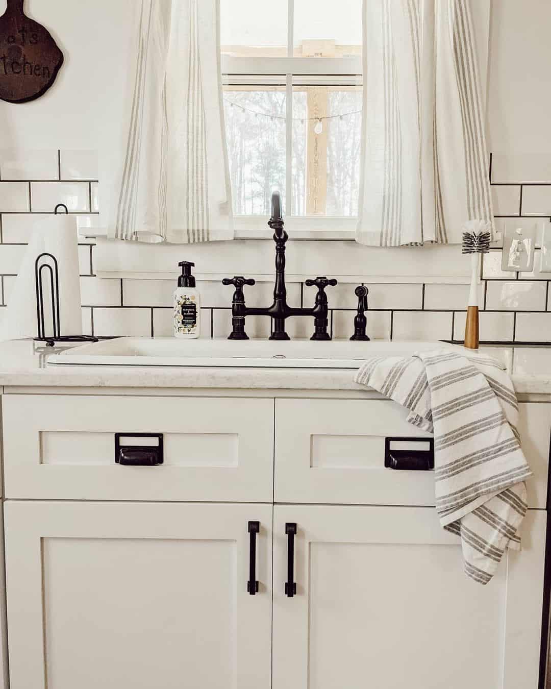 White Subway Tile with Black Grout Backsplash
